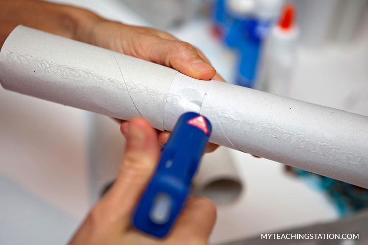 Recycled toilet paper roll assembled to create american flag for kids craft.