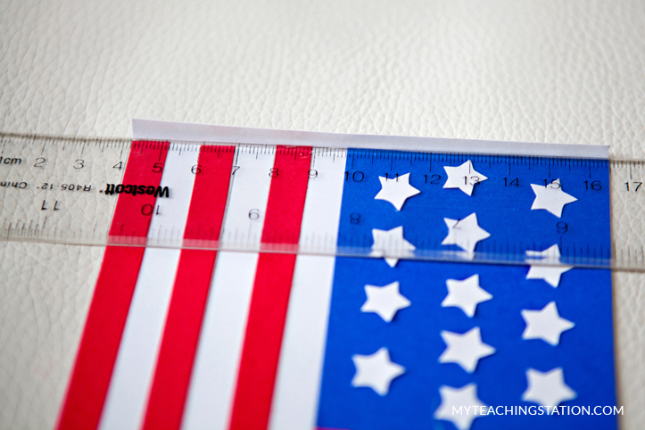Fold the side of the U.S. flag to attach it to paper towel roll in this kids art craft.
