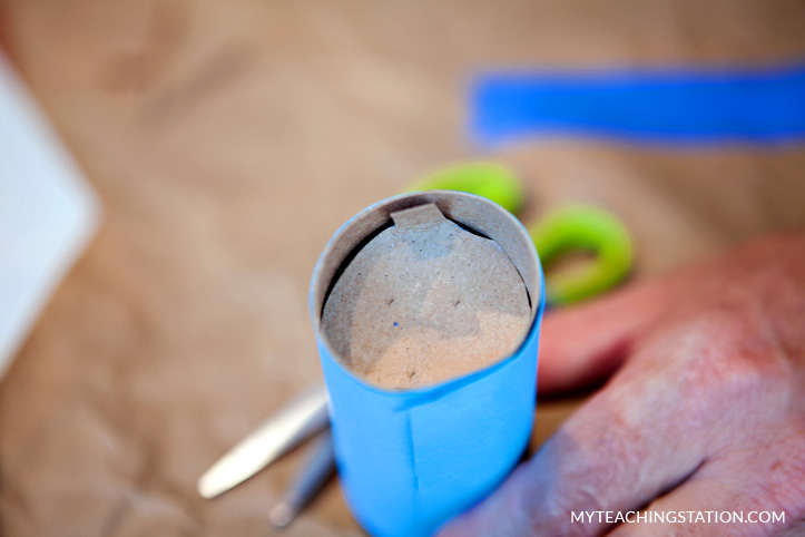 Attach cap into one of the ends of the toilet paper roll