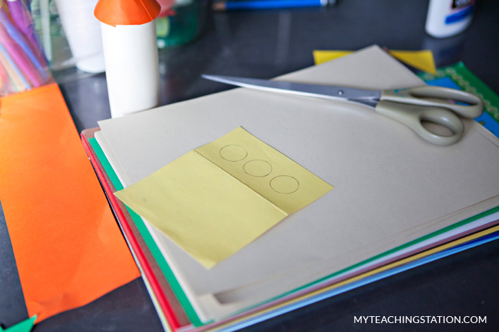 Yellow paper circles to make rocket windows