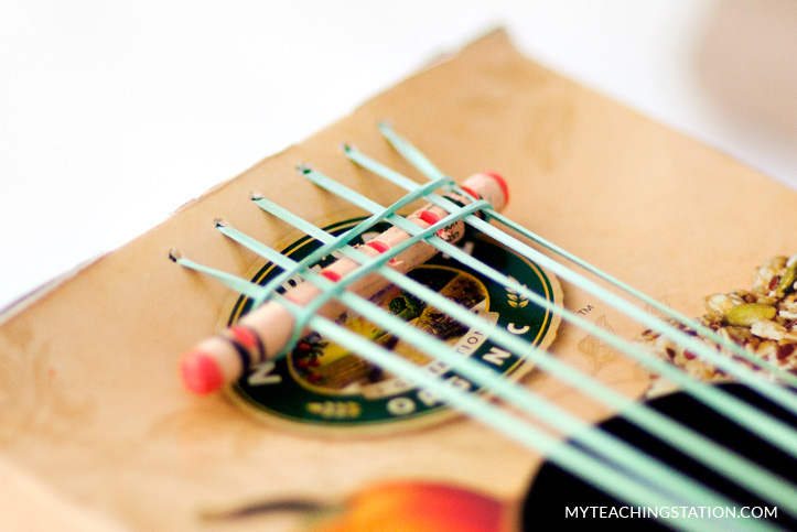 Making the kids guitar from a cereal box.