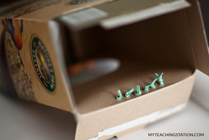 Using rubber bands and a cereal box to create a guitar for kids.